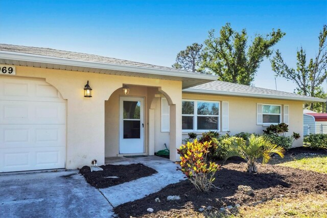 property entrance with a garage