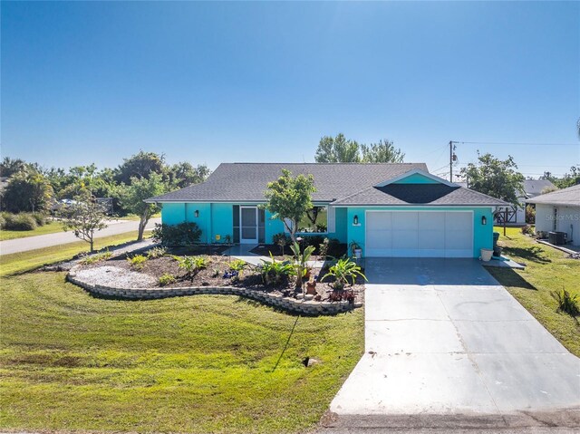 single story home featuring an attached garage, driveway, a front yard, and stucco siding