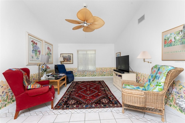 living room with light tile patterned floors, ceiling fan, vaulted ceiling, and visible vents