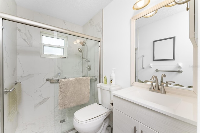 full bath featuring toilet, a marble finish shower, a textured ceiling, and vanity