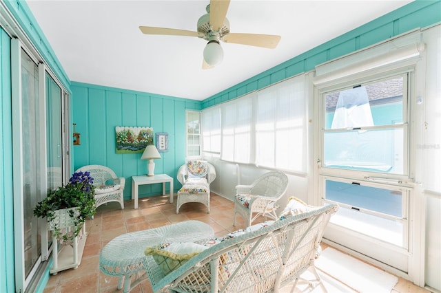 sunroom with a ceiling fan