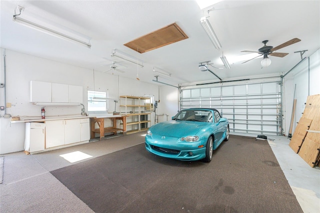 garage featuring a garage door opener and ceiling fan