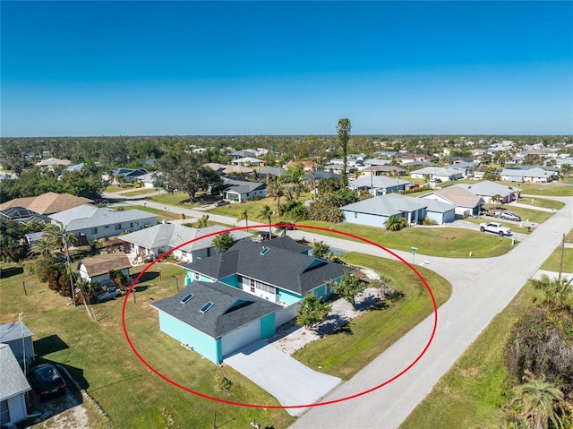 birds eye view of property with a residential view