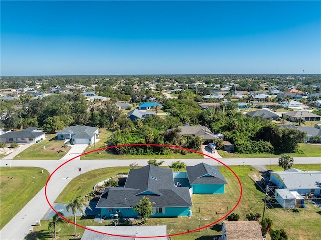 birds eye view of property with a residential view