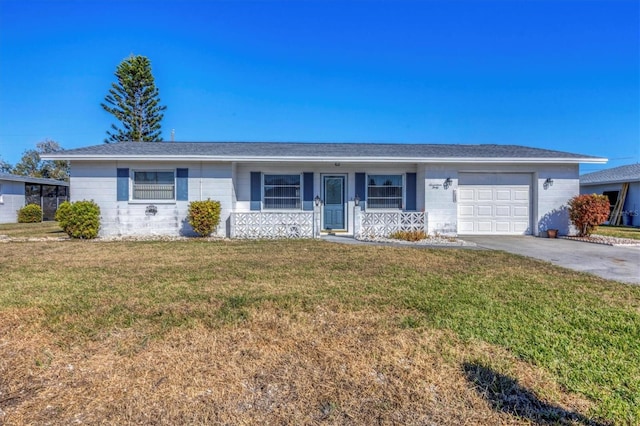 single story home featuring a garage and a front lawn