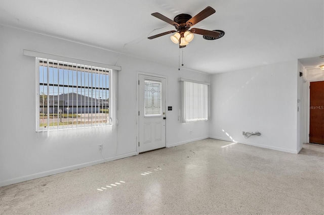 interior space with ceiling fan and a healthy amount of sunlight