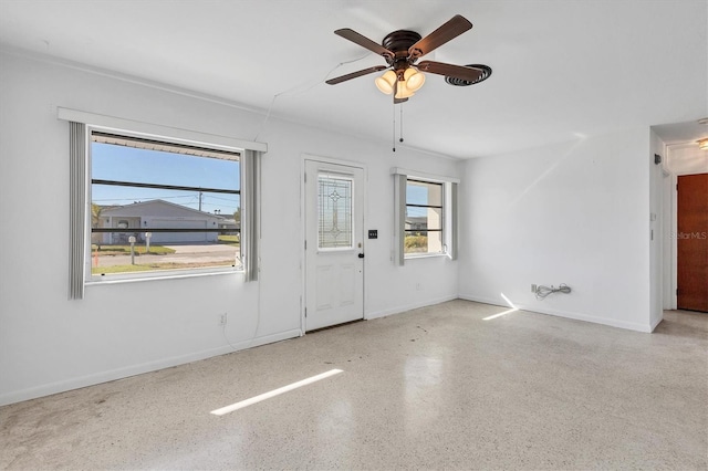 empty room featuring ceiling fan