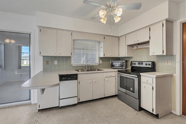 kitchen with backsplash, ceiling fan, sink, and stainless steel appliances