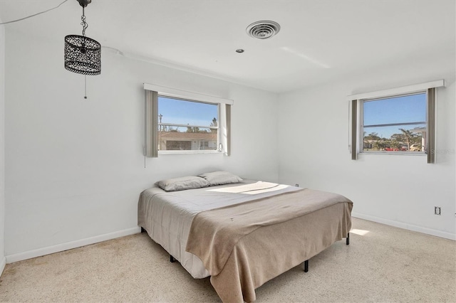 bedroom featuring multiple windows