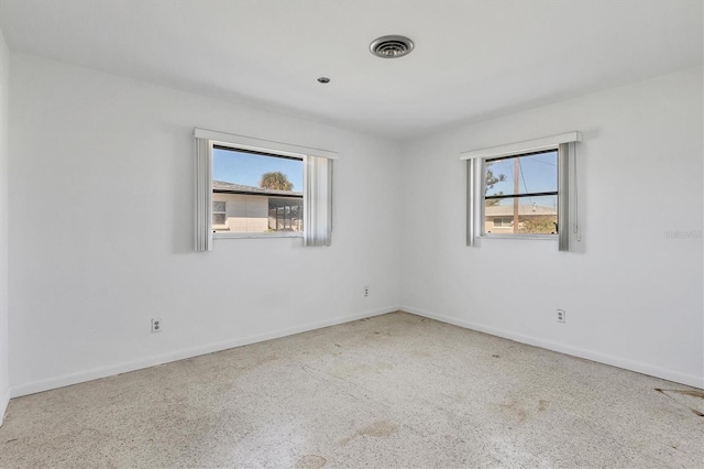 unfurnished room featuring a healthy amount of sunlight