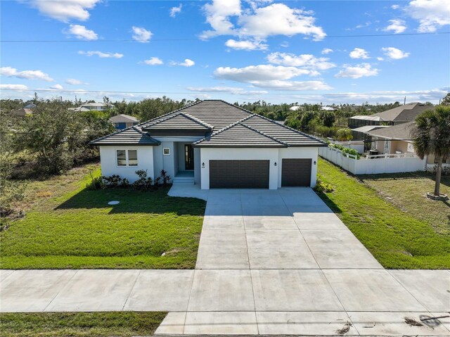 14681 Keystone Blvd, Port Charlotte, FL 33981 - view of front of home featuring an attached garage, concrete driveway, stucco siding, and a tiled roof