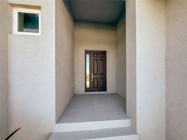 14681 Keystone Blvd, Port Charlotte, FL 33981 - view of exterior entry featuring stucco siding
