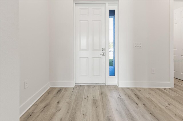 14681 Keystone Blvd, Port Charlotte, FL 33981 - foyer with light wood-style floors and baseboards