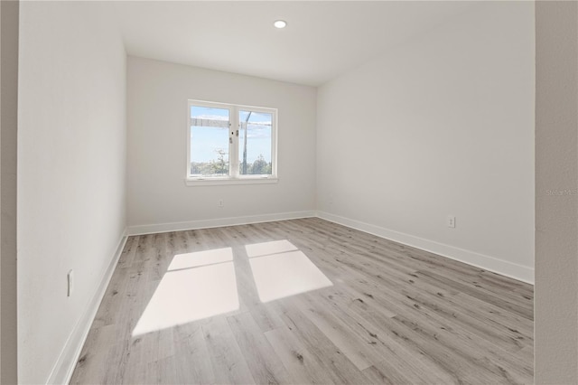 spare room with light hardwood / wood-style floors