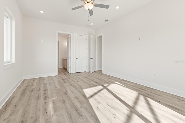 unfurnished bedroom with ceiling fan, light hardwood / wood-style flooring, and ensuite bath