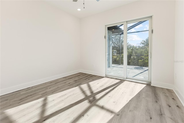 unfurnished room featuring ceiling fan and light hardwood / wood-style flooring