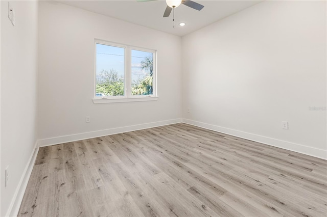 spare room featuring ceiling fan and light hardwood / wood-style floors