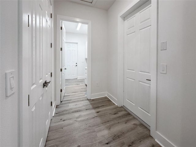 corridor featuring light hardwood / wood-style flooring