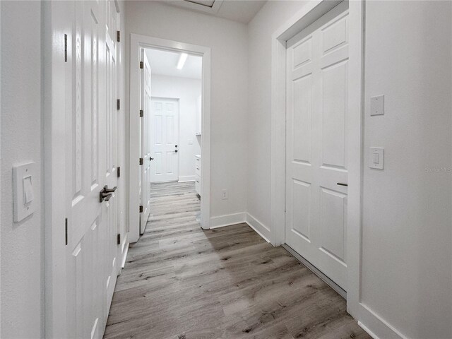 14681 Keystone Blvd, Port Charlotte, FL 33981 - hallway featuring light wood finished floors and baseboards