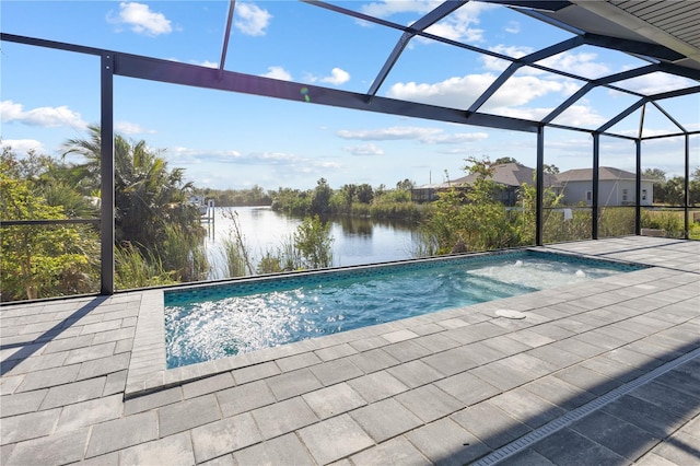 view of pool with a patio, a water view, and a lanai