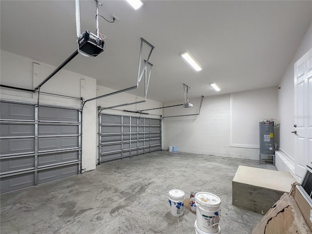 garage with a garage door opener and water heater