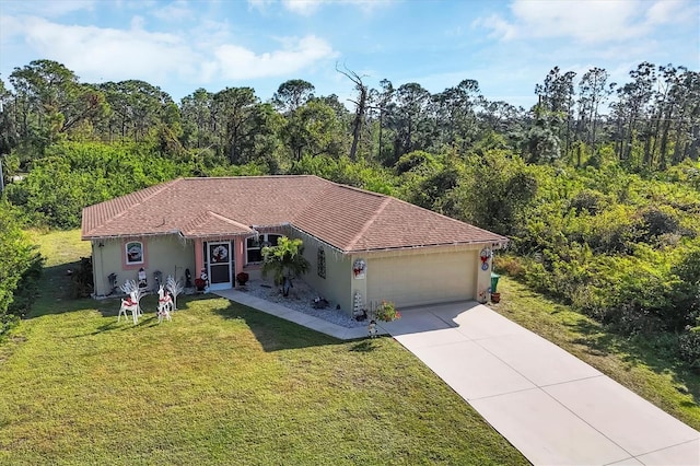 view of front facade with a garage and a front lawn