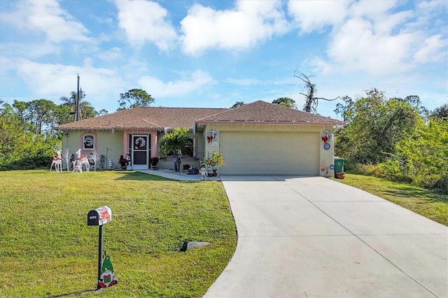 ranch-style home featuring a garage and a front lawn