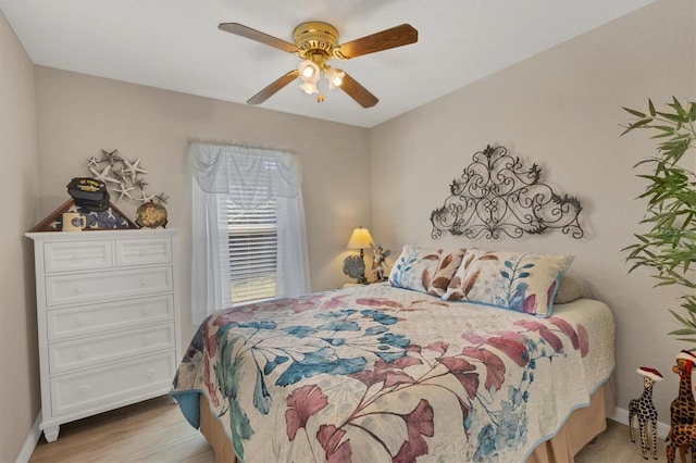 bedroom featuring ceiling fan and light wood-type flooring