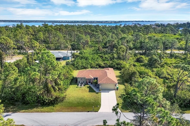 birds eye view of property featuring a water view