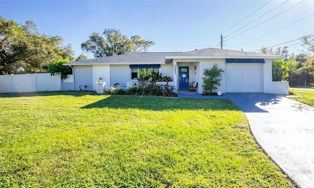 ranch-style home with a garage and a front lawn