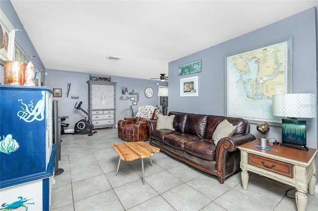 living room featuring light tile patterned floors and ceiling fan