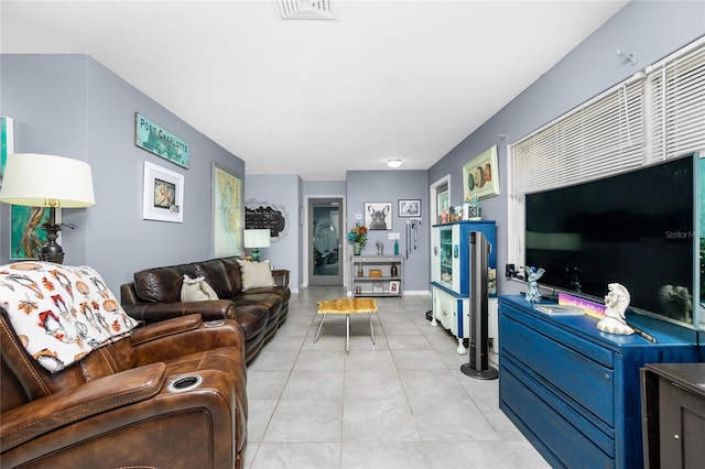 living room with light tile patterned floors