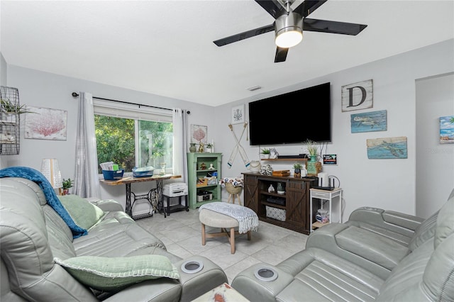 tiled living room featuring ceiling fan