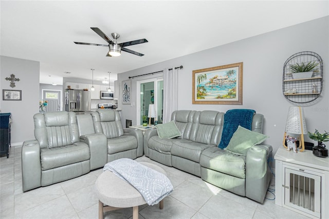 living room featuring light tile patterned floors and ceiling fan