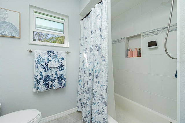 bathroom with curtained shower and toilet