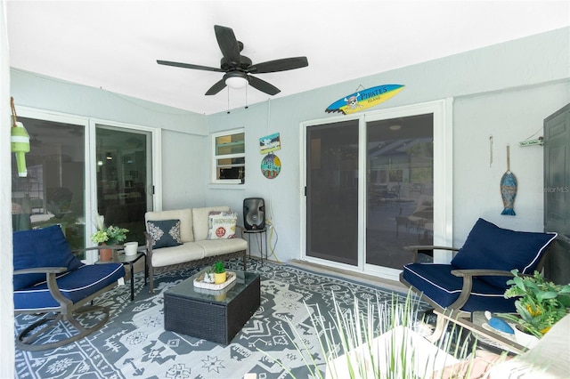 view of patio / terrace with an outdoor living space and ceiling fan