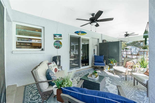 view of patio featuring ceiling fan