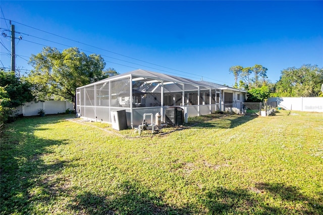 exterior space with a lanai and a yard