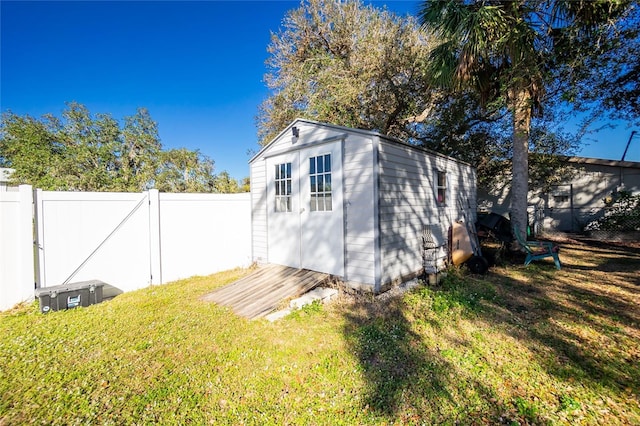 view of outbuilding featuring a yard