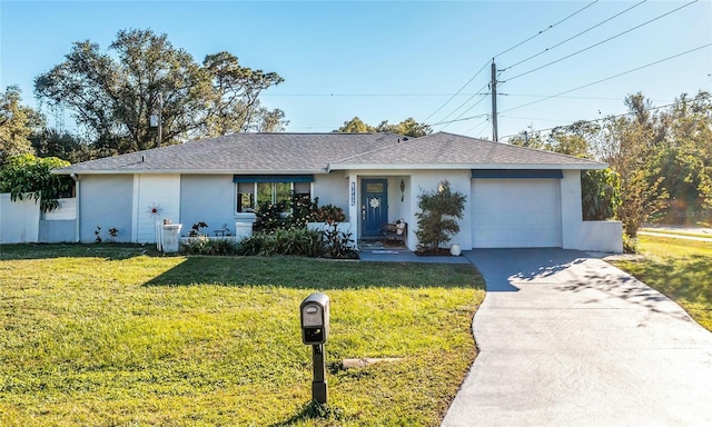 single story home with a garage and a front yard