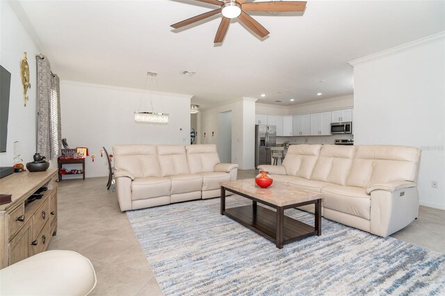 living room with ceiling fan, crown molding, and light tile patterned flooring