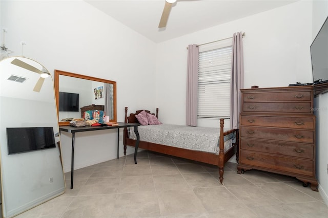 tiled bedroom featuring ceiling fan