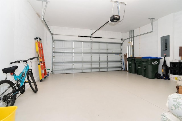 garage featuring electric panel and a garage door opener