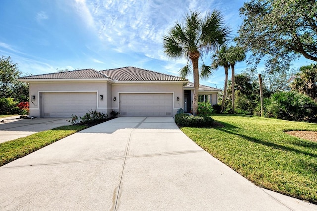 view of front of home with a garage and a front yard