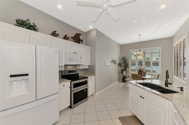 kitchen with white cabinetry, sink, backsplash, decorative light fixtures, and white appliances