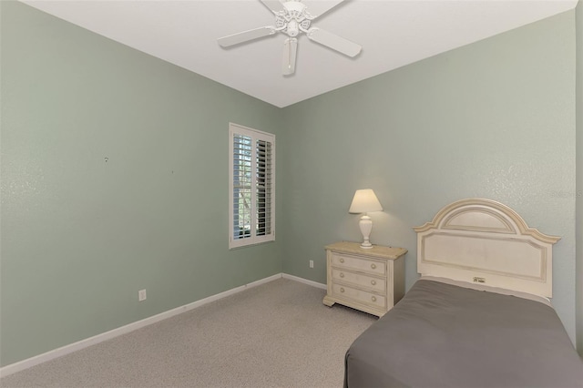 unfurnished bedroom with ceiling fan and light colored carpet