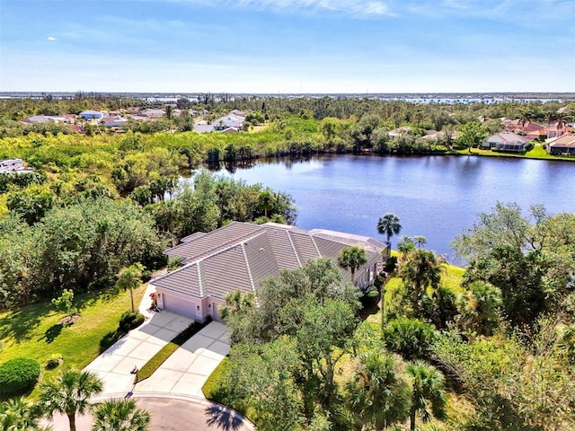 birds eye view of property with a water view