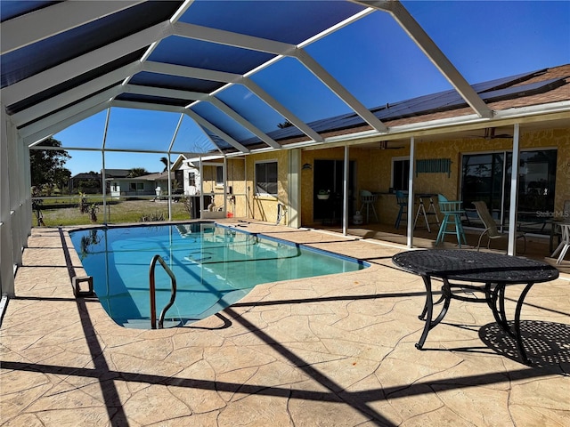 view of pool with a lanai and a patio area