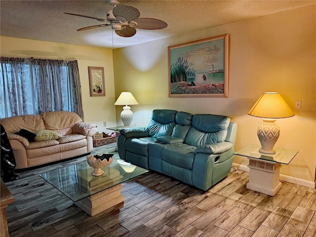 living room with hardwood / wood-style floors, a textured ceiling, and ceiling fan