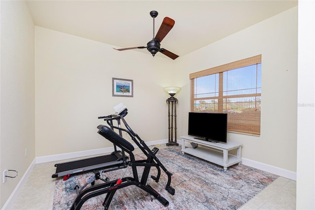 exercise area featuring ceiling fan and light tile patterned floors